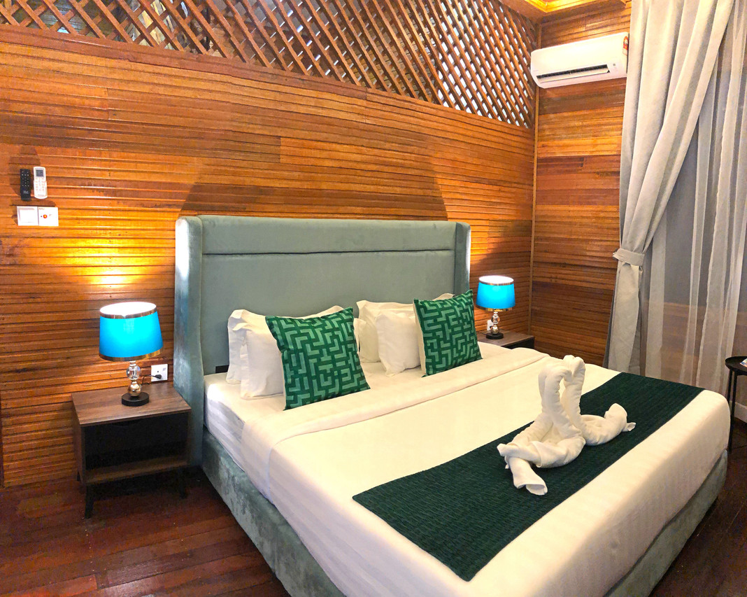 Deluxe Villa wood-panelled bedroom
